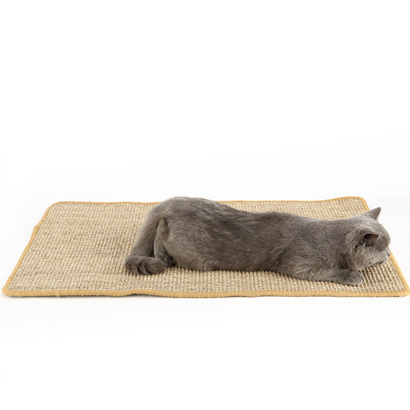 Cat lying on a natural sisal scratching mat
