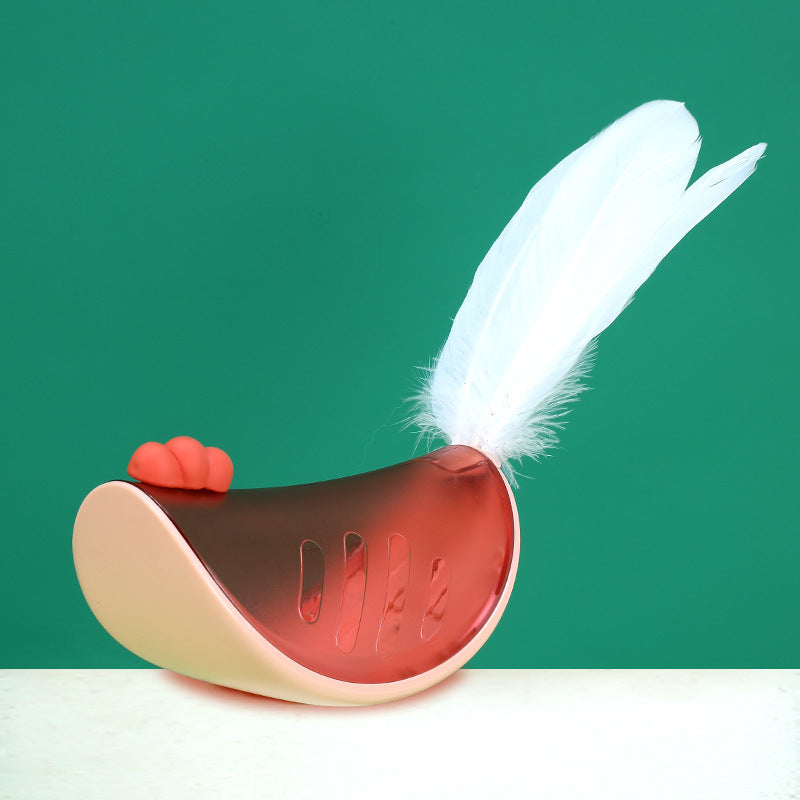 Pink cat tumbler toy with feather attachment