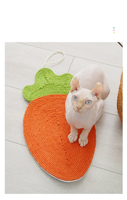 Sphynx cat using an orange carrot-shaped scratching mat