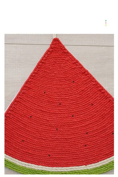 Close-up of a watermelon-shaped cat scratching mat